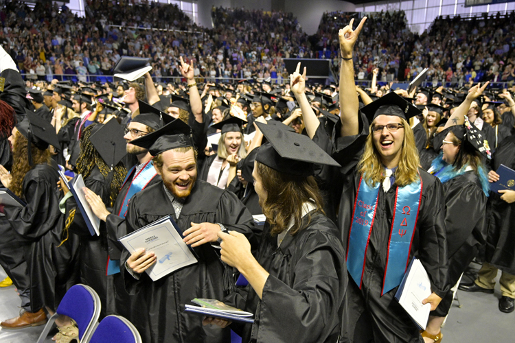 Excited MTSU undergraduate students celebrate receiving their degrees Saturday, May 4, during the university’s spring 2019 morning commencement ceremony. MTSU presented 2,145 undergrads with their diplomas in two events Saturday and 384 graduate students with degrees May 3, bringing the university’s total new alumni to 2,529. (MTSU photo by Andy Heidt)