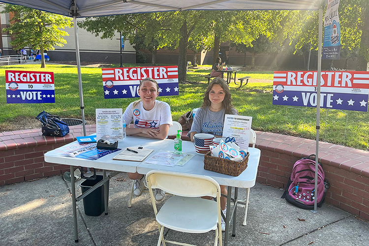 Kayla Jenkins, Middle Tennessee State University graduate student, left, and Megan Perry, business administration sophomore and member of the Student Government Association, staff the on-campus voter registration tent on Sept. 20, 2022, National Voter Registration Day, to work toward the university’s goal to get a record number of MTSU students registered to vote and out to the polls for the upcoming election. (MTSU photo by Stephanie Barrette)