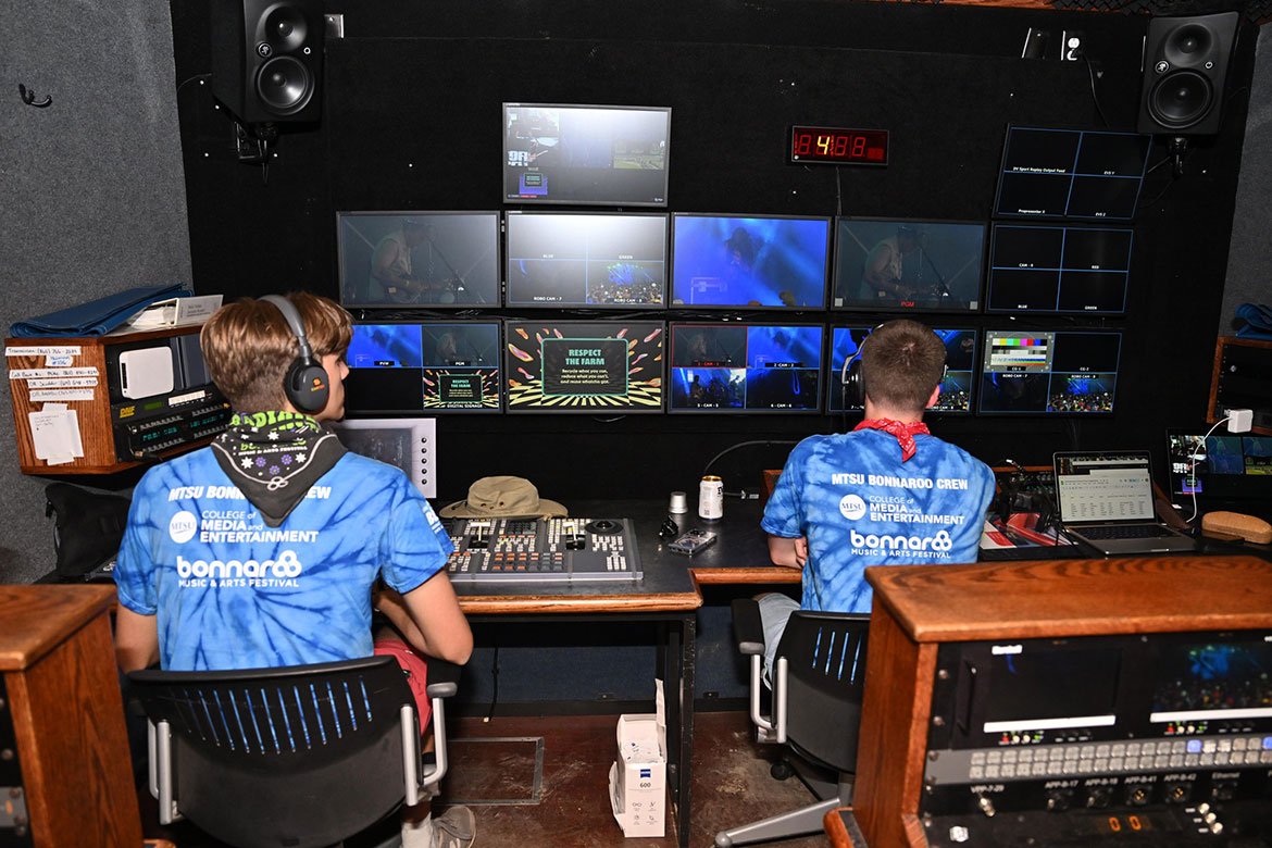 Middle Tennessee State University College of Media and Entertainment students work inside the mobile production lab, known as “The Truck,” during the 2025 Bonnaroo Music and Arts Festival in Manchester, Tenn. Before inclement weather cancelled the four-day event Friday, June 13, MTSU students had directed concerts and had other hands-on experiences from setting up to breaking down equipment, directing, running cameras and more. (MTSU photo by James Cessna)