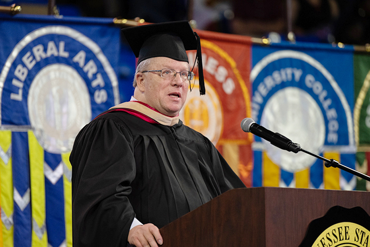 MTSU associate professor Robert Gordon encourages the August 2022 graduating class to "be true, be authentic, be transparent" as well as "True Blue" Saturday, Aug. 6, at the university's summer commencement ceremony inside Murphy Center. MTSU presented 857 degrees to undergrad and graduate students during the event, which concludes the university's 111th academic year. (MTSU photo by James Cessna)
