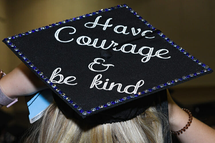 A summer 2018 MTSU graduate adjusts her personalized mortarboard as she prepares for the August commencement ceremony inside Murphy Center. MTSU will present degrees to 1,731 students during dual fall 2018 commencement ceremonies Saturday, Dec. 15. (MTSU photo by GradImages)
