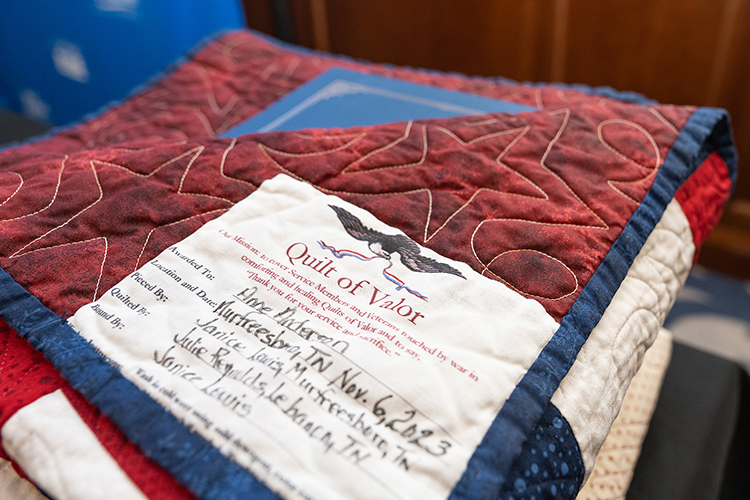 Anne Anderson, one of the honorees at the Women Warriors program held at Middle Tennessee State University Nov. 6, 2023, was one of three veterans presented with a Quilt of Valor blanket for military service. Two others were honored with bracelets at the annual event spotlighting women veterans. (MTSU photo by Cat Curtis Murphy)