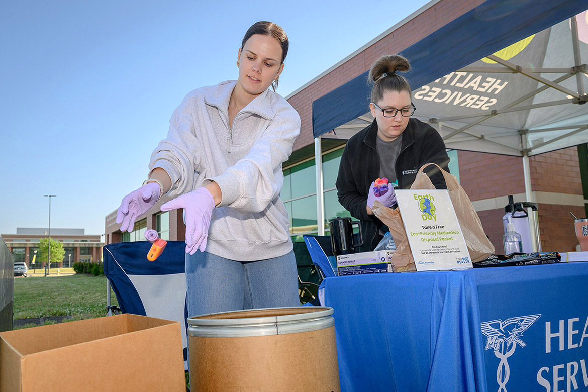 Sorting through discarded, outdated medications during the biannual Drug-Vape Take-Back event held Thursday, March 23, on campus at Middle Tennessee State University in Murfreesboro, Tenn., are Prevention Coalition for Success coordinator Morgan Verdeck, left, and Ariel Todd, a fourth-year pharmacy student at Lipscomb University. The event is hosted biannually by MTSU as part of the Drug Enforcement Administration’s national initiative to provide a safe, convenient and environmentally responsible way to dispose of unneeded medications while also educating about the abuse of prescription drugs. (MTSU photo by J. Intintoli)